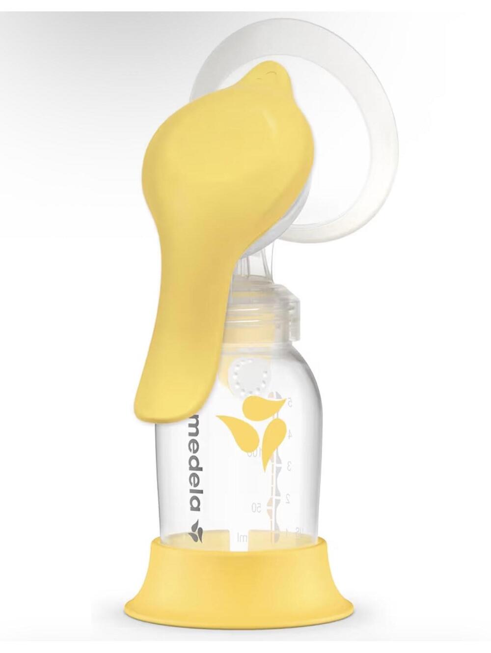 Medela Manual Breast Pump with Yellow Handle and Bottle